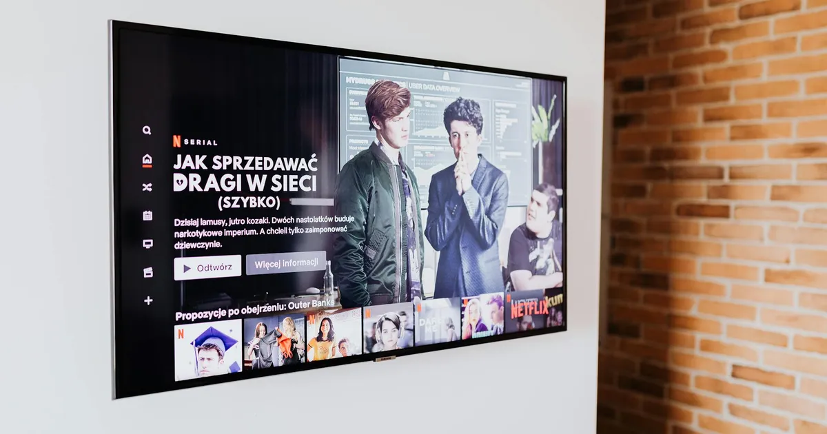 Woman watching 4K Netflix on smart TV, holding remote; Disney+ app icon visible; fast internet router on a modern living room table.